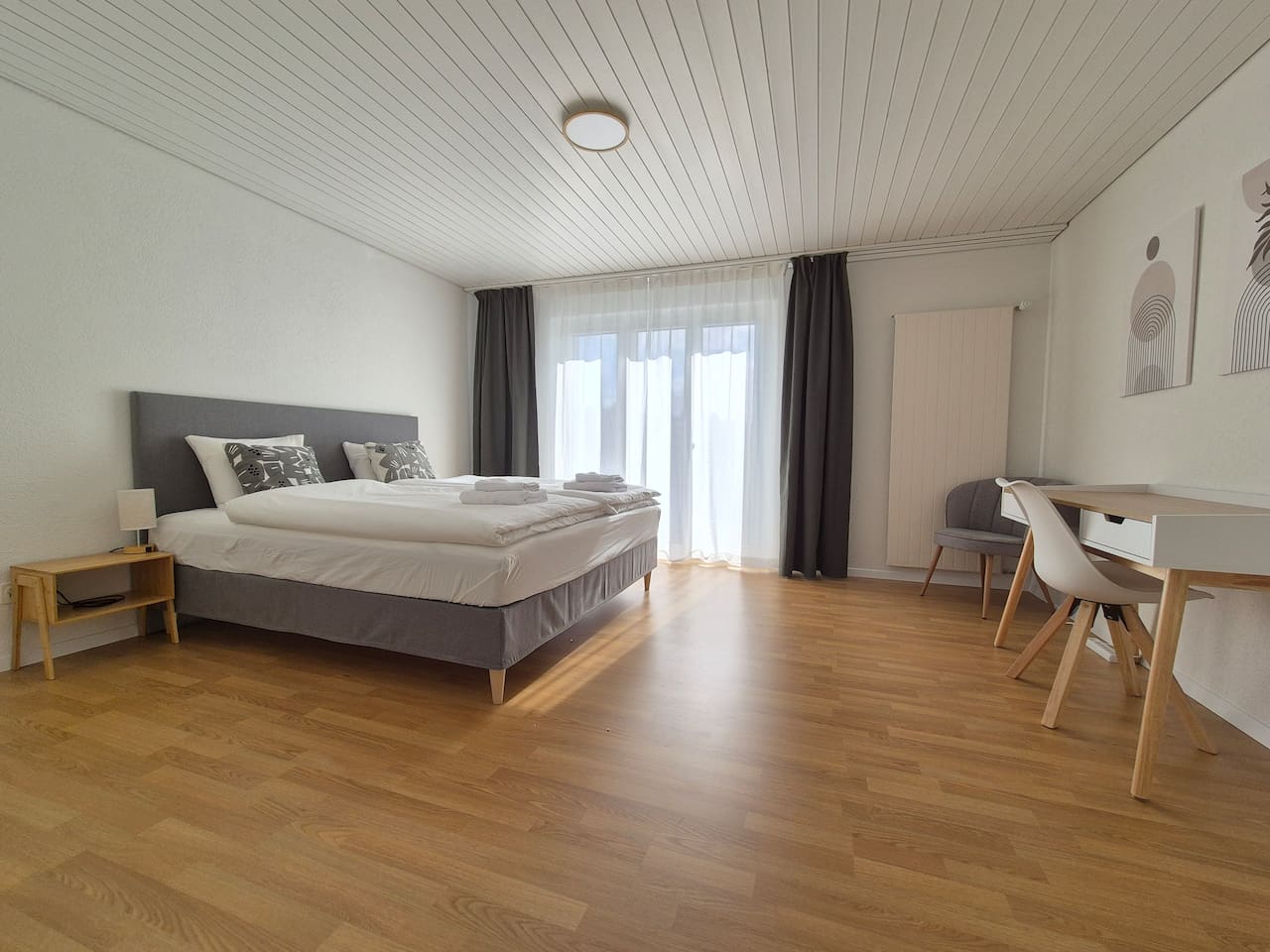 Bedroom 1: King sized boxspring bed (180x200cm) with desk, wardrobe / closet and a private balcony