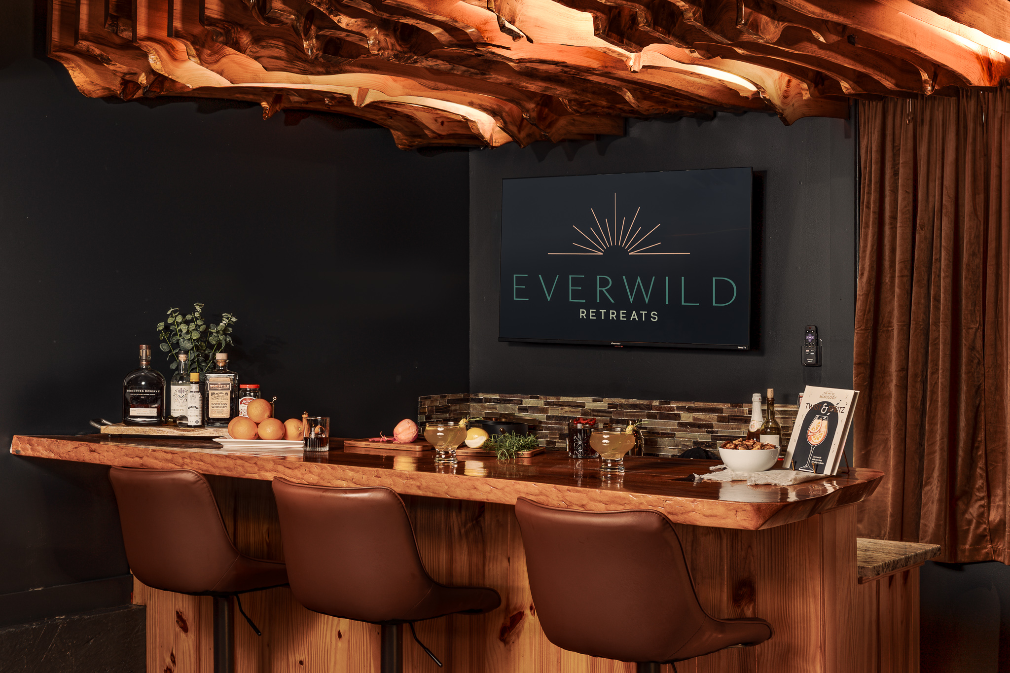 {Speakeasy Bar} Pour a drink and settle into your private mountain speakeasy, complete with a custom wood bar and moody lounge atmosphere made for late-night hangs.