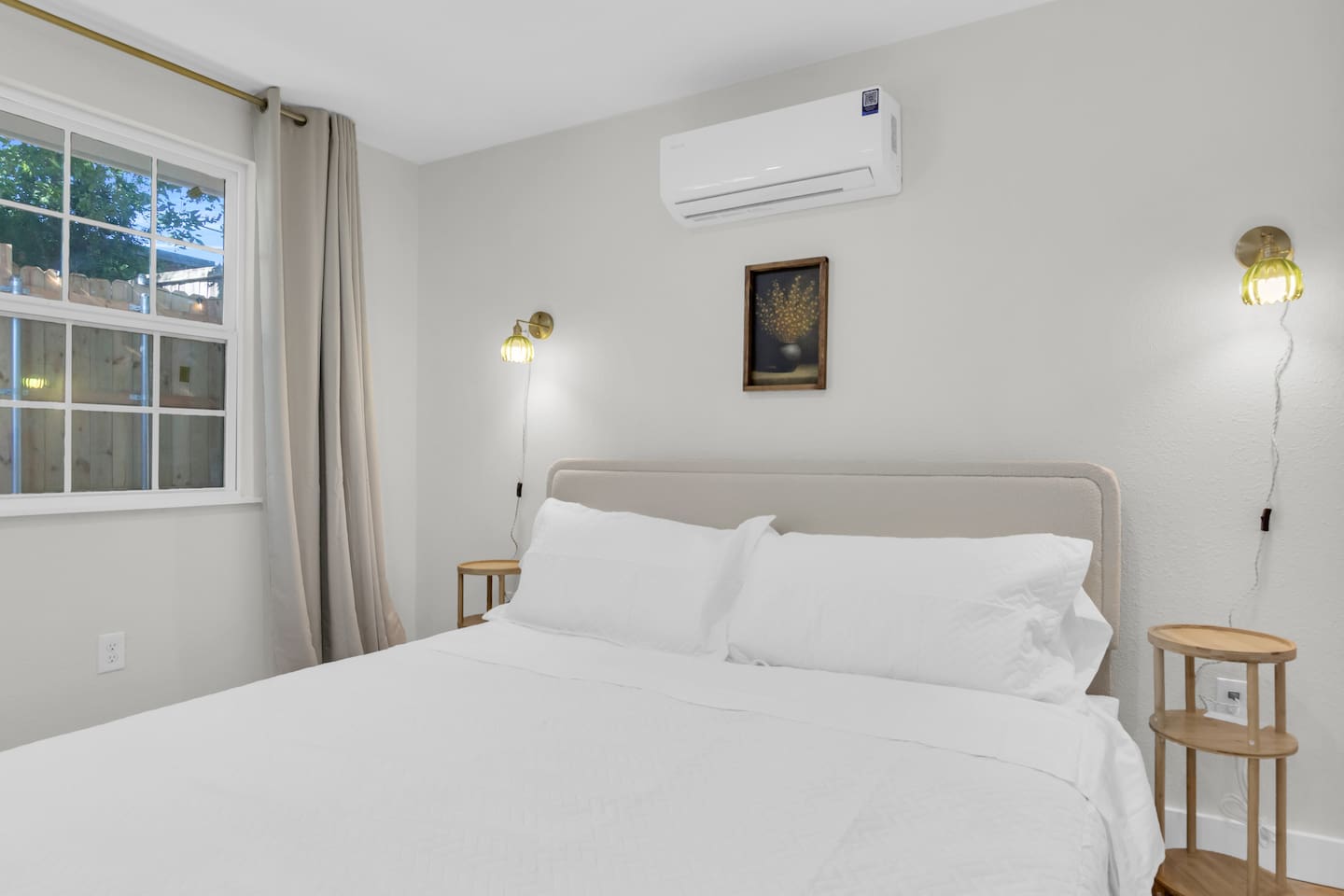 Comfort meets style with a plush king bed, room-darkening blinds, air conditioning, warm lighting, with a perfect view of the TV for movie nights in.