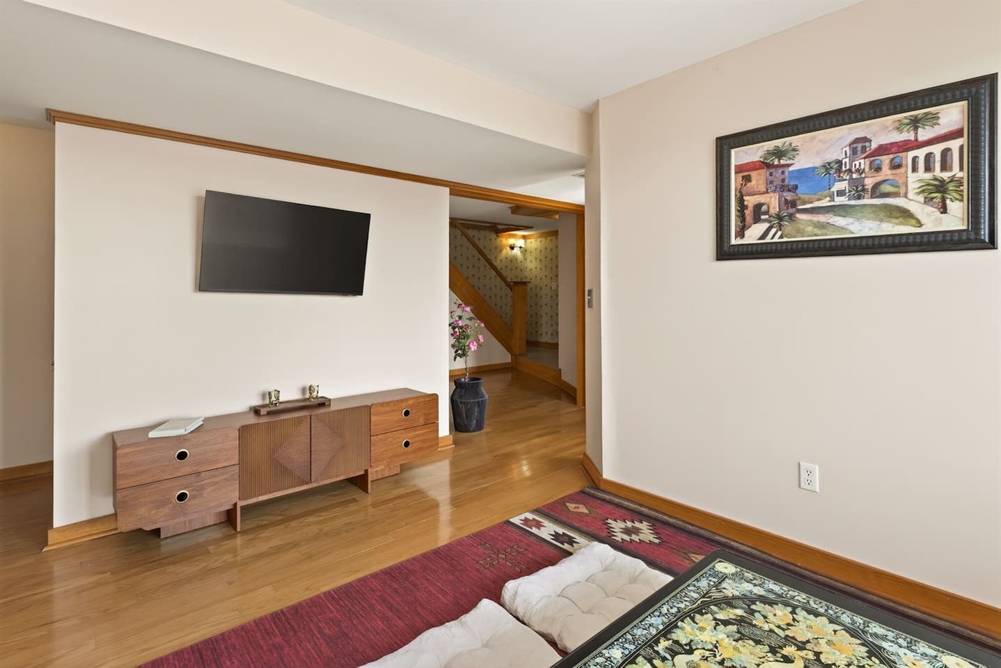 Relax in a Japanese-style living room with a low table, floor seating cushions, and warm, calming design—perfect for tea, conversation, or quiet moments, blending comfort and culture into a unique, peaceful retreat experience