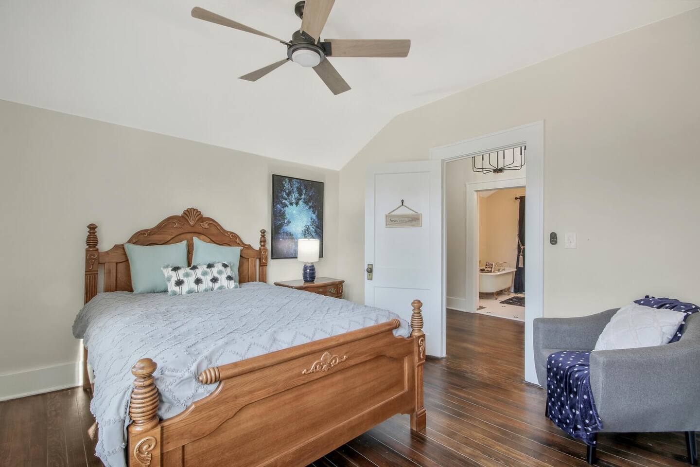 Kansas Starry Nights feature night photography from Kansas artists, and constellation projector on the ceiling and a ceiling fan. Queen size bed.