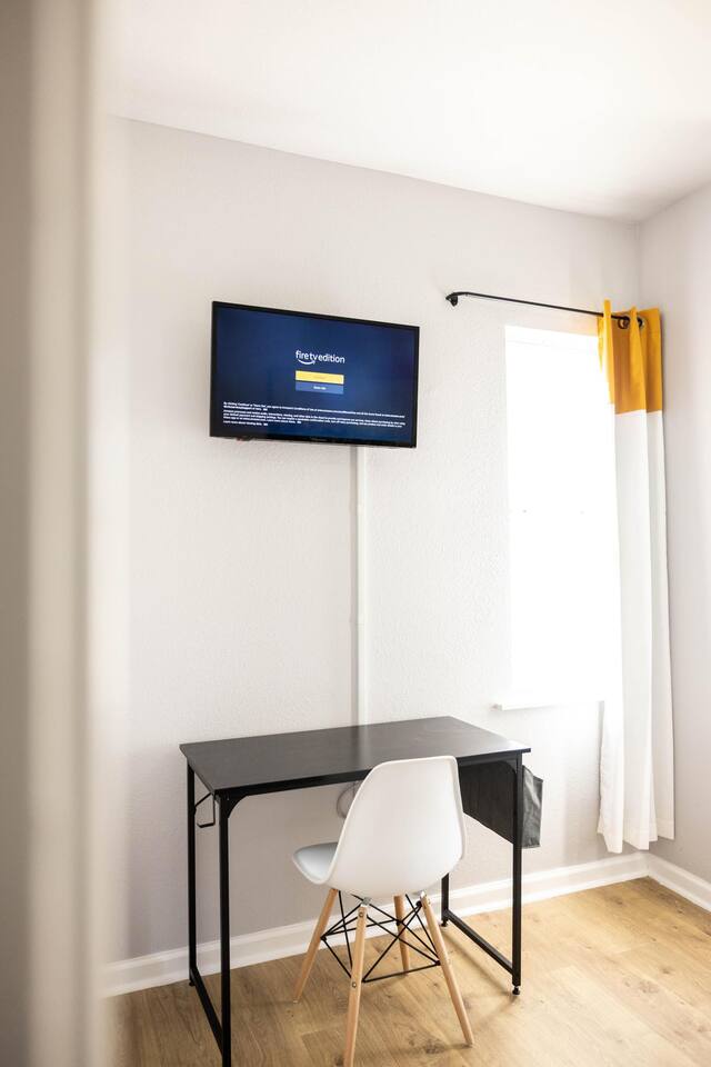 A functional work desk in the king bedroom offers a quiet space for remote work or study during your stay.