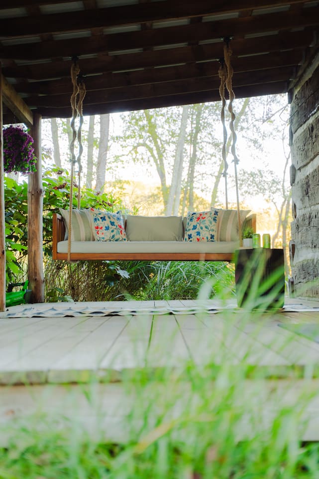 Swing into serenity on the cozy porch, surrounded by nature.