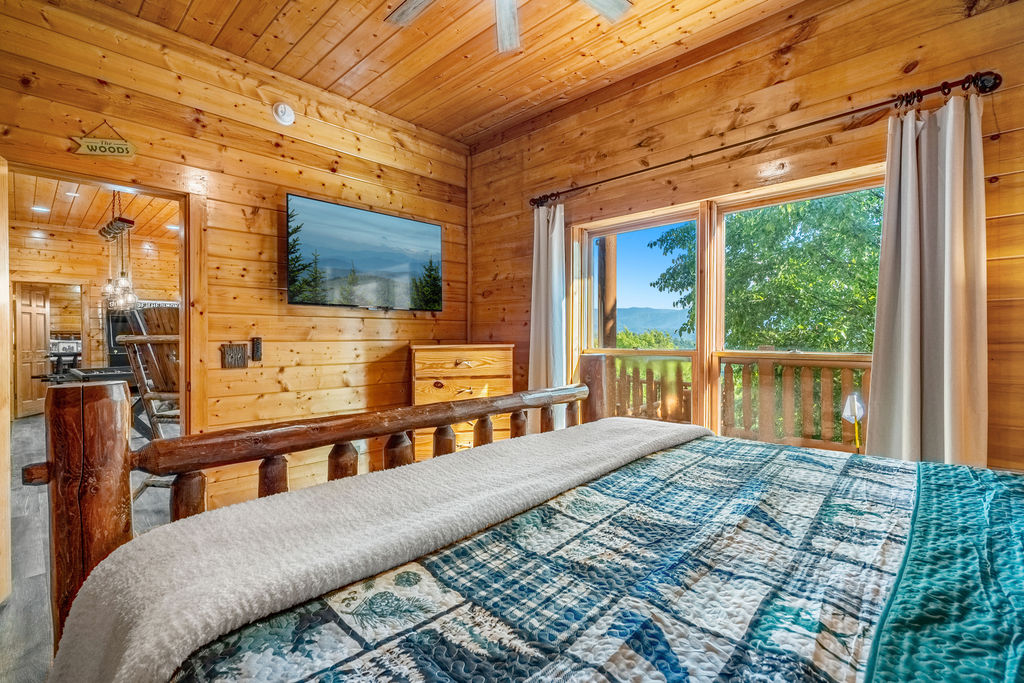 This cozy king bedroom features rustic charm and plush comfort, sharing a full bathroom with the adjacent bunk room&mdash;ideal for families or groups staying together.