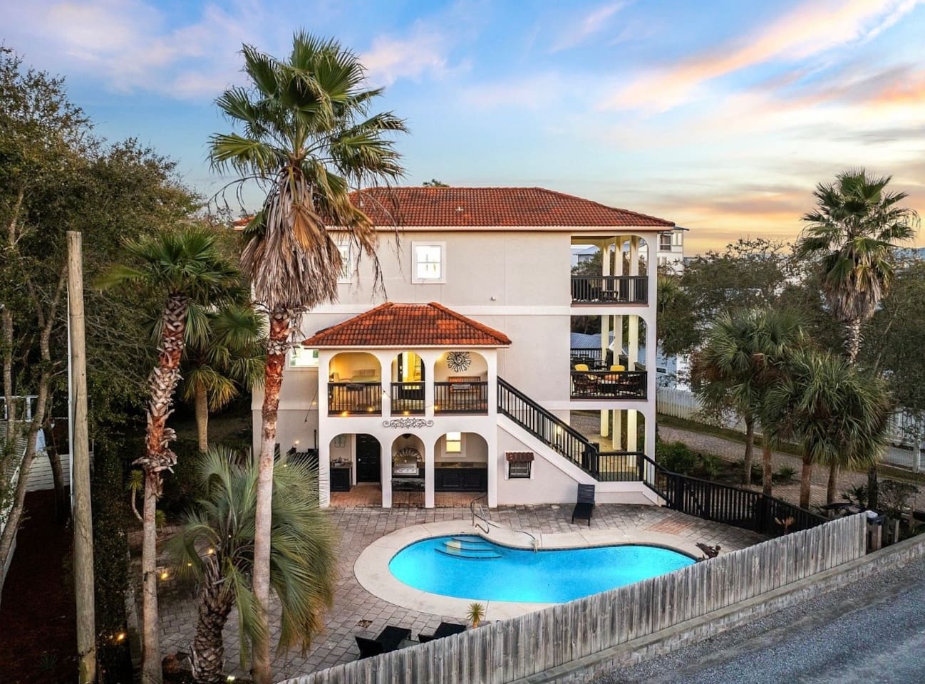 Private pool and multi-level outdoor living space for group relaxation.