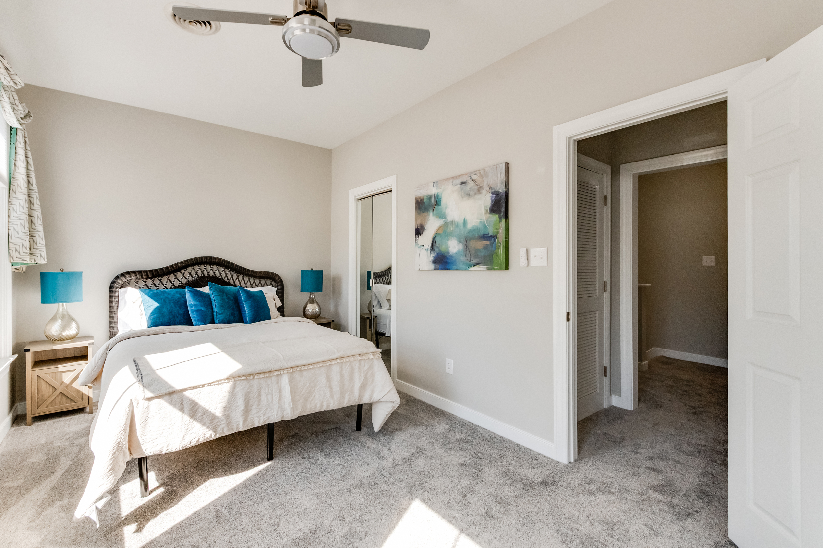 Queen Bedroom 2: Bright space with plush bedding and vibrant accents for a refreshing stay!
