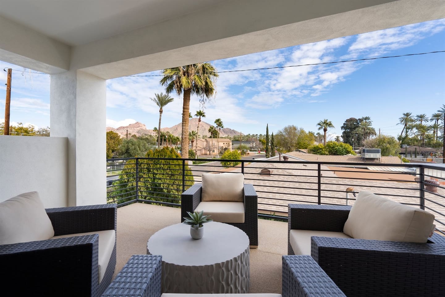 Step onto the balcony, featuring comfortable seating that beautifully extends the living room, perfect for morning coffee or evening relaxation.