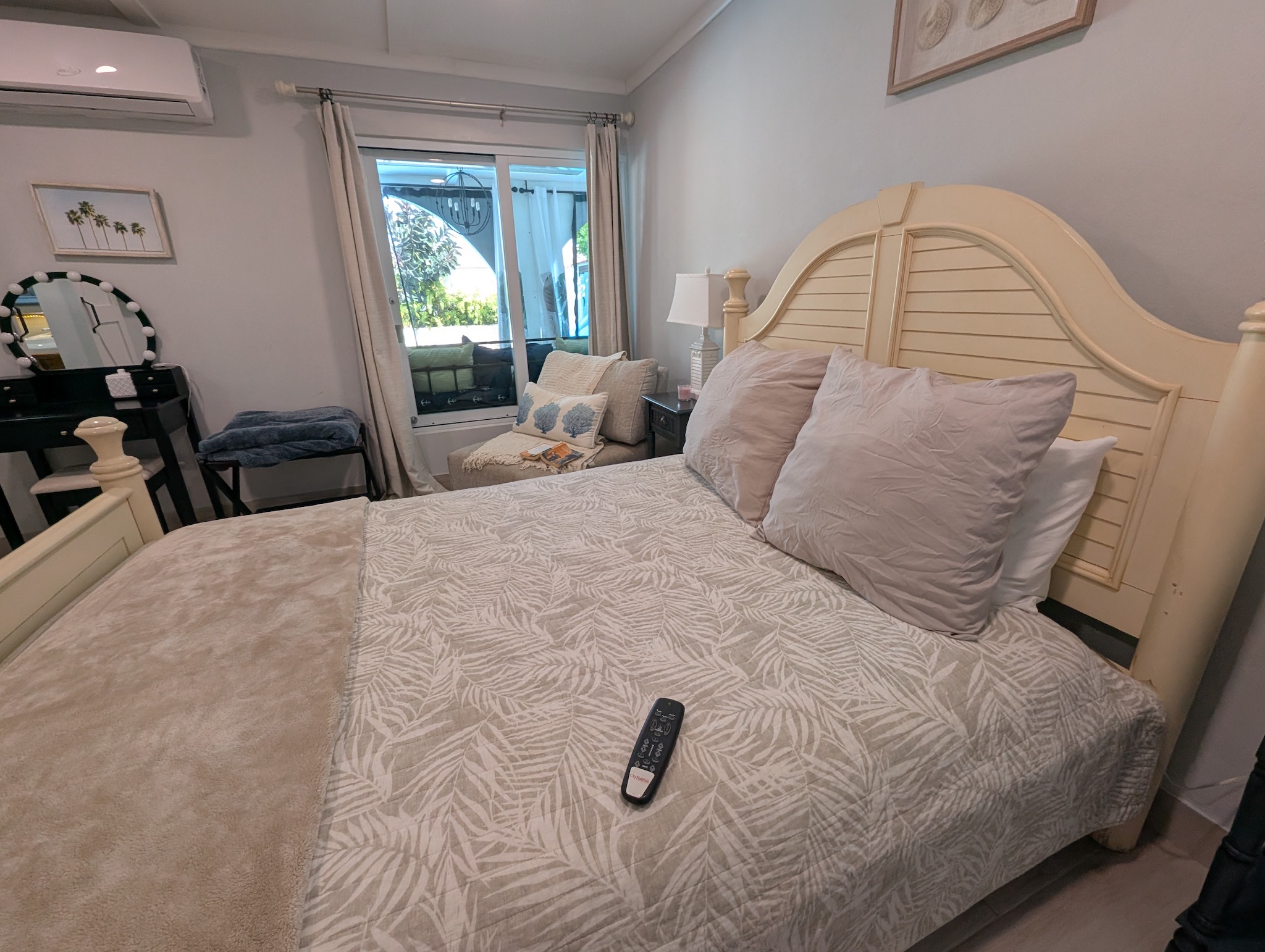 View across queen adjustable bed with remote for lifting head and feet and included massage. 