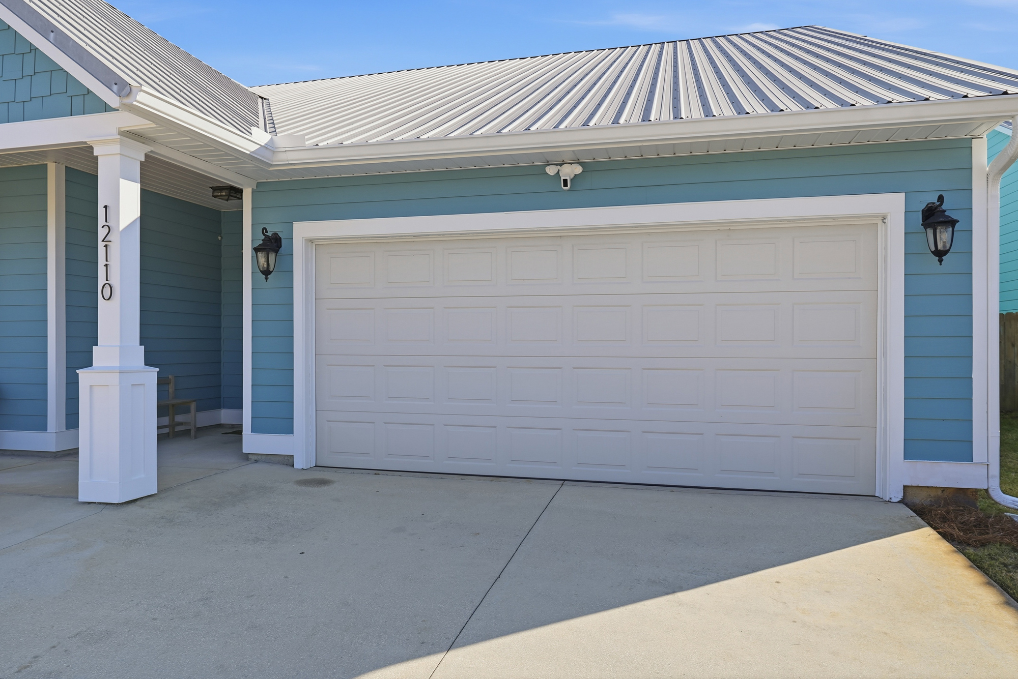 Attached garage with convenient storage, parking and an extra refrigerator for guest use.