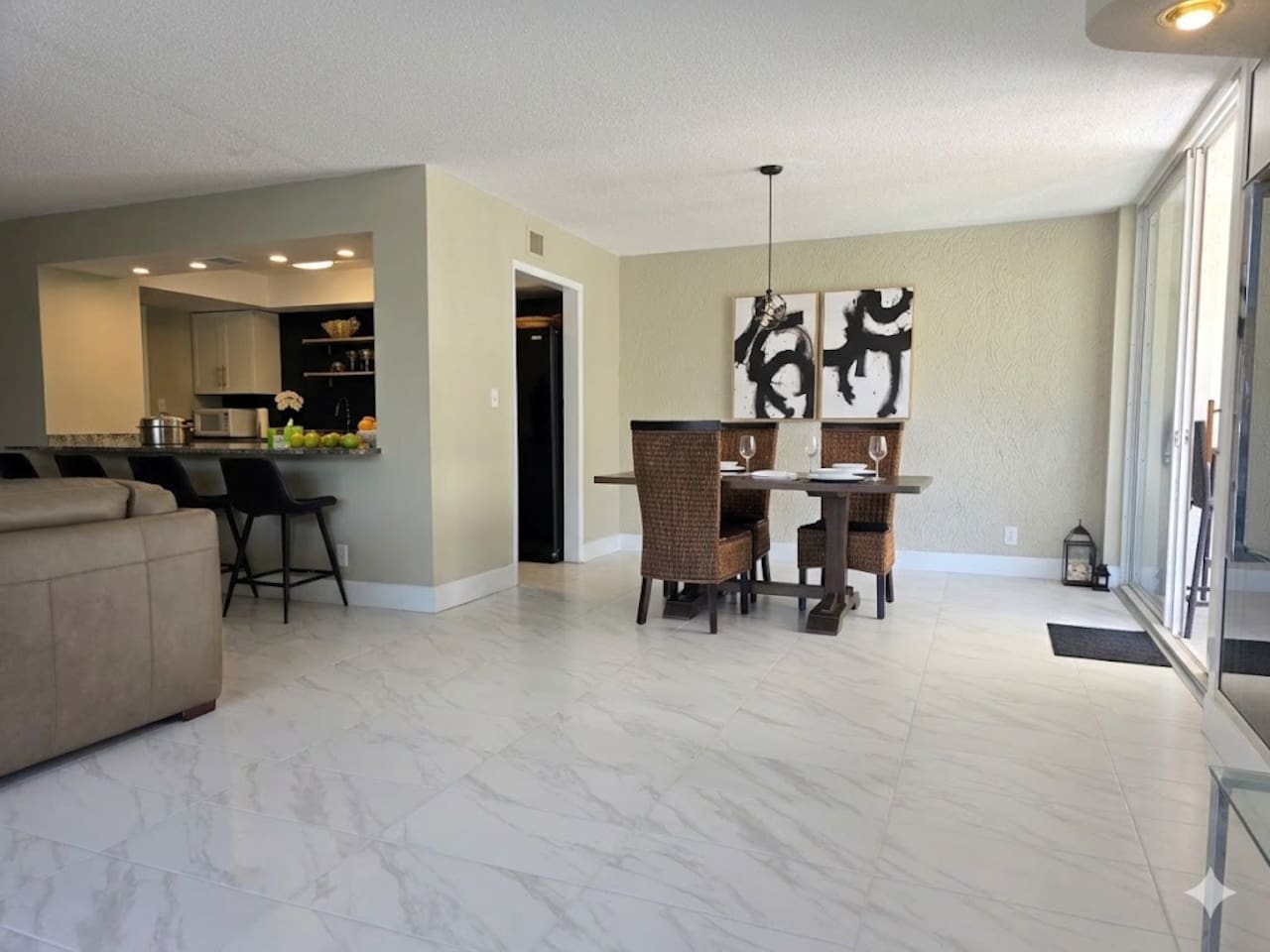 Dining room with seating for 4 at the table and 4 at the bar.