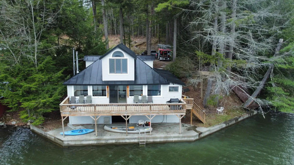 The cabin tucked right on the lake with private dock access.