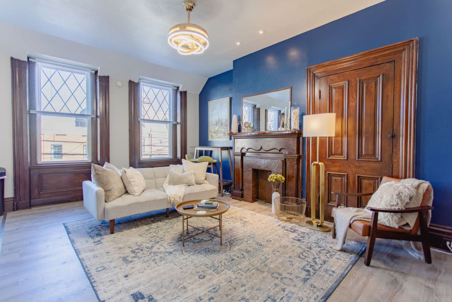 Spacious and inviting living room with cozy seating, perfect for relaxing, socializing, or enjoying a movie night.