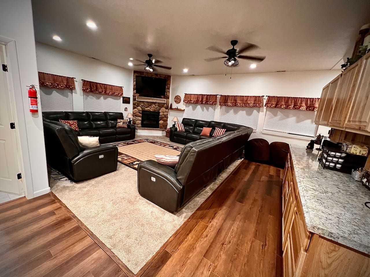 Enter into the cabin into the cozy Great Room.   Recline in the Italian Leather Sectionals and watch a movie from the 55" TV over the River rock Fireplace.