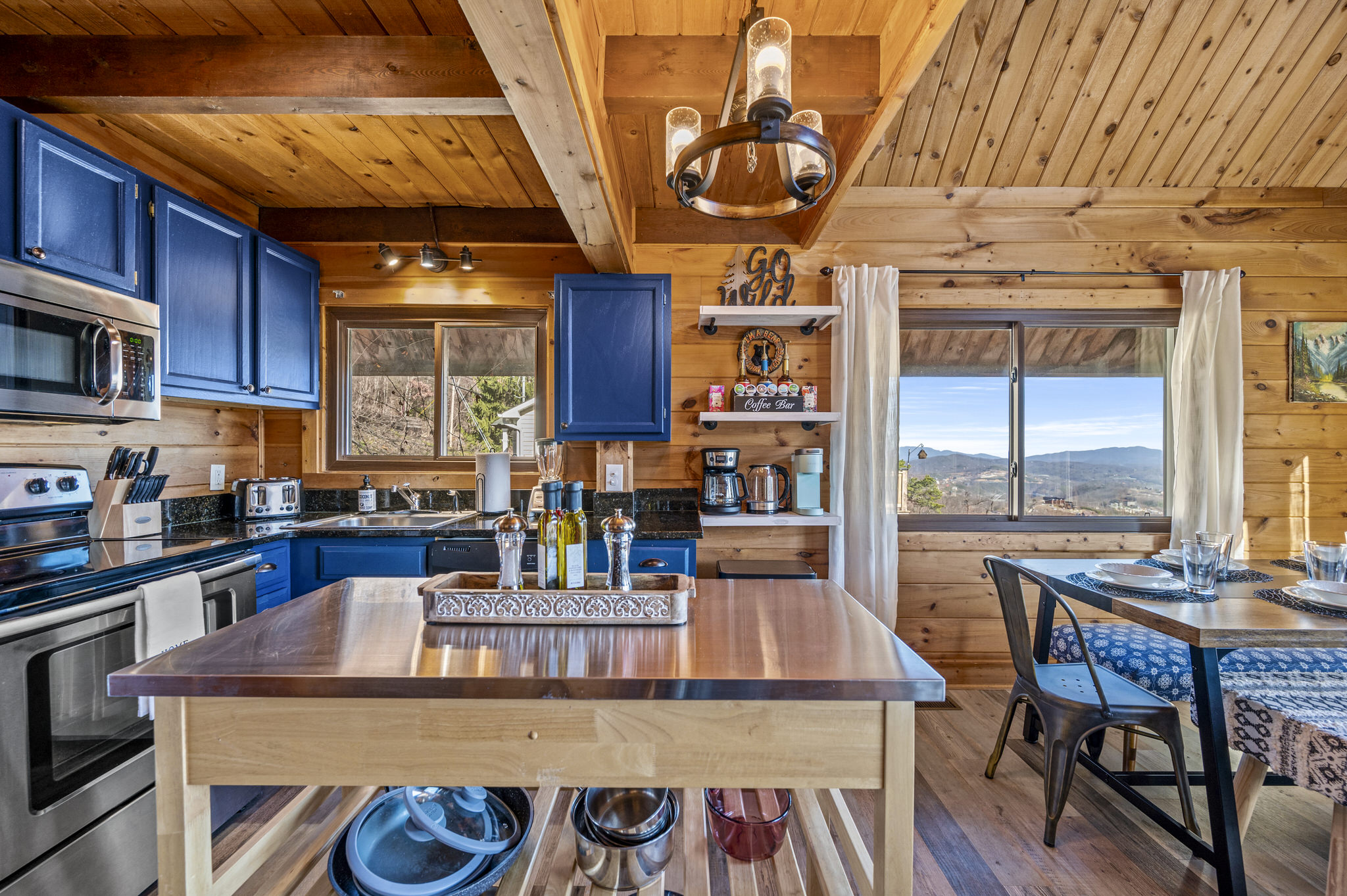 Kitchen may be on smaller side but it has all of the amenities, plus a park style grill out front for additional cooking.  Crockpot, toaster, coffee maker, hot water tea kettle, blender, plenty of baking dishes and utensils help to make most possible.