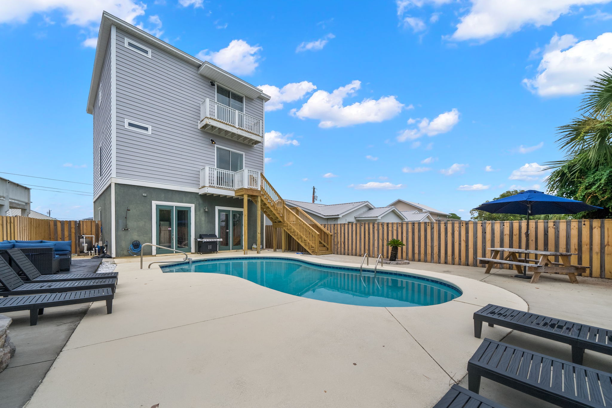 Outside Grill, lounge chairs, picnic table...  Grill, chill, savor- pool days done right 