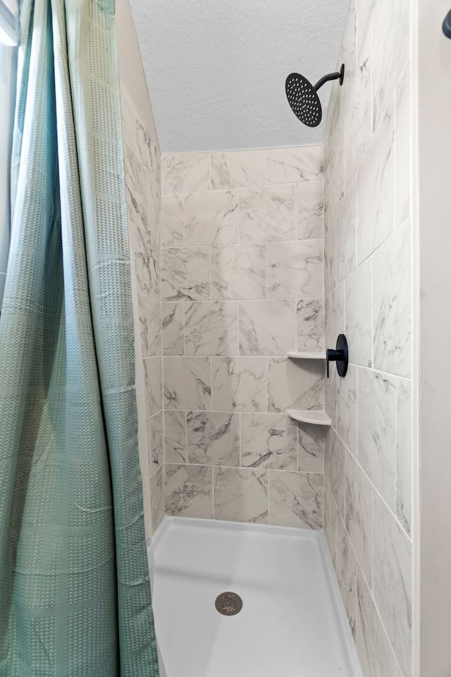 A sleek, tiled stand-up shower offering a modern and clean design.