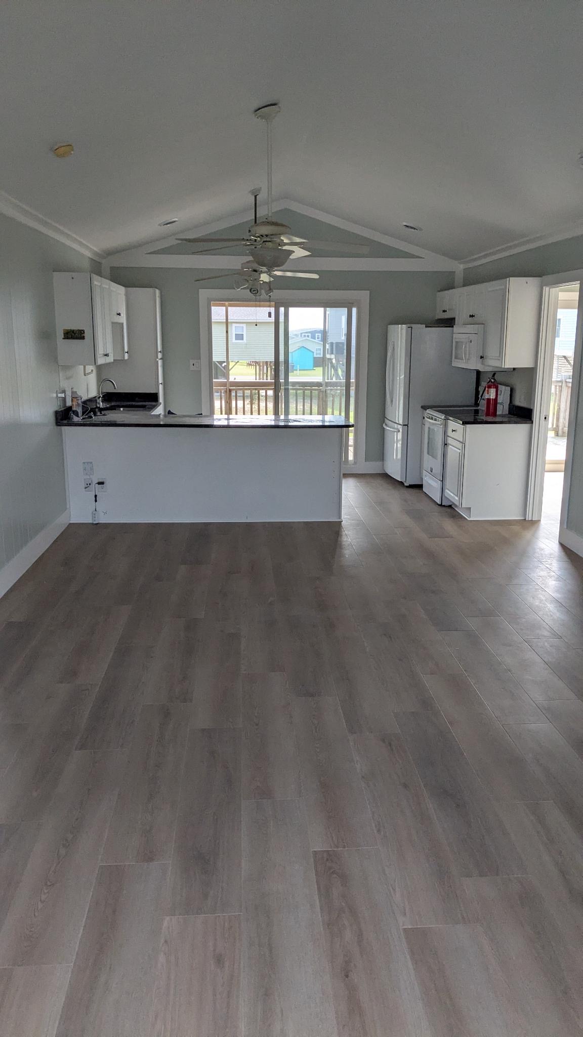 Inside is officially done! Just need to get furniture in now. This is the view from the living room to the kitchen.