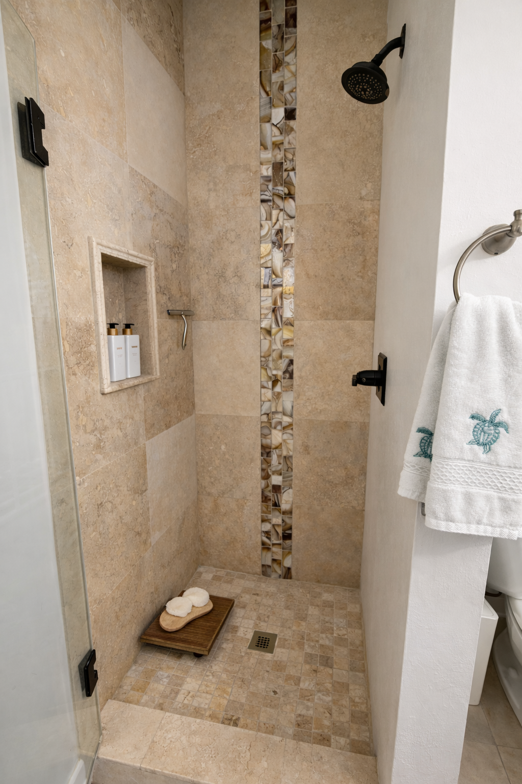 Walk-in shower with natural stone tile