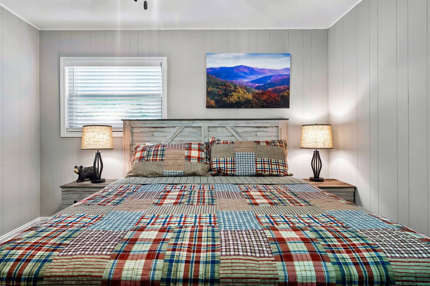 Unwind in the inviting second bedroom, featuring a cozy king mattress and a Samsung smart HD TV for your entertainment and relaxation needs. #RestfulNights