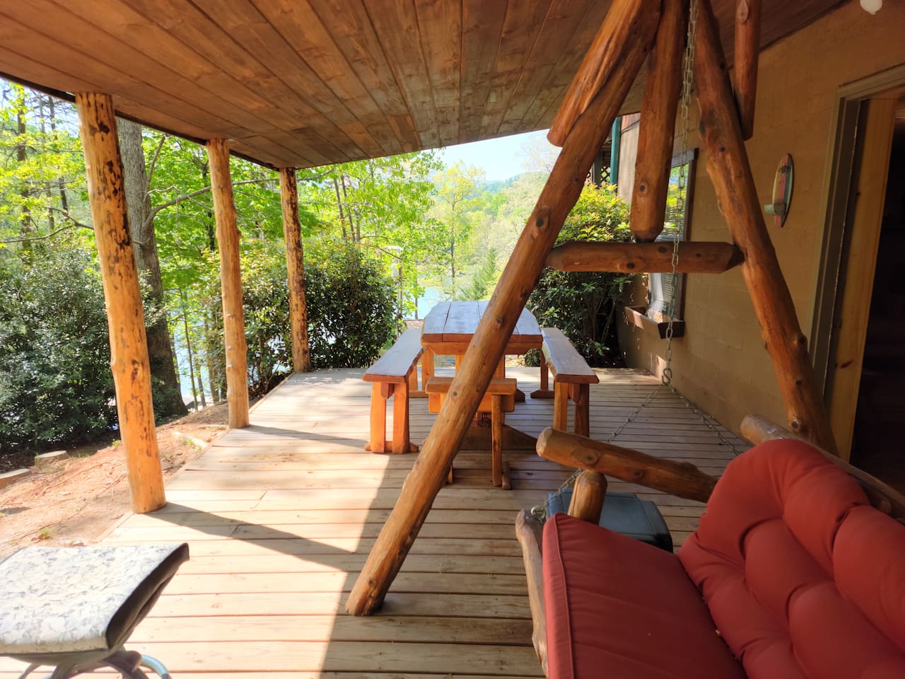 Lower level deck with log swing, 2 picnic tables and exceptional lake/mountain/river views!