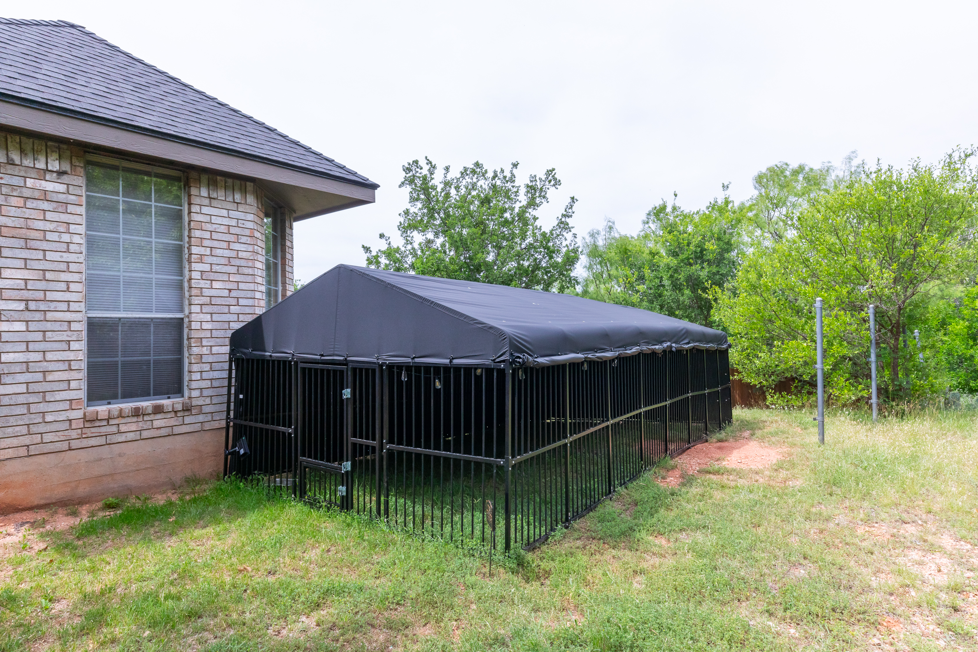 A new covered Dog Run has been added at the house!