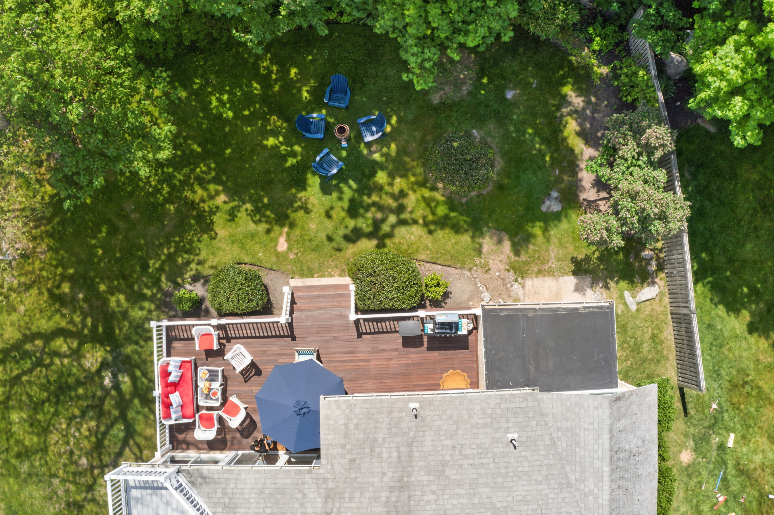 An aerial view of the house showing the overall property layout and surrounding outdoor spaces.