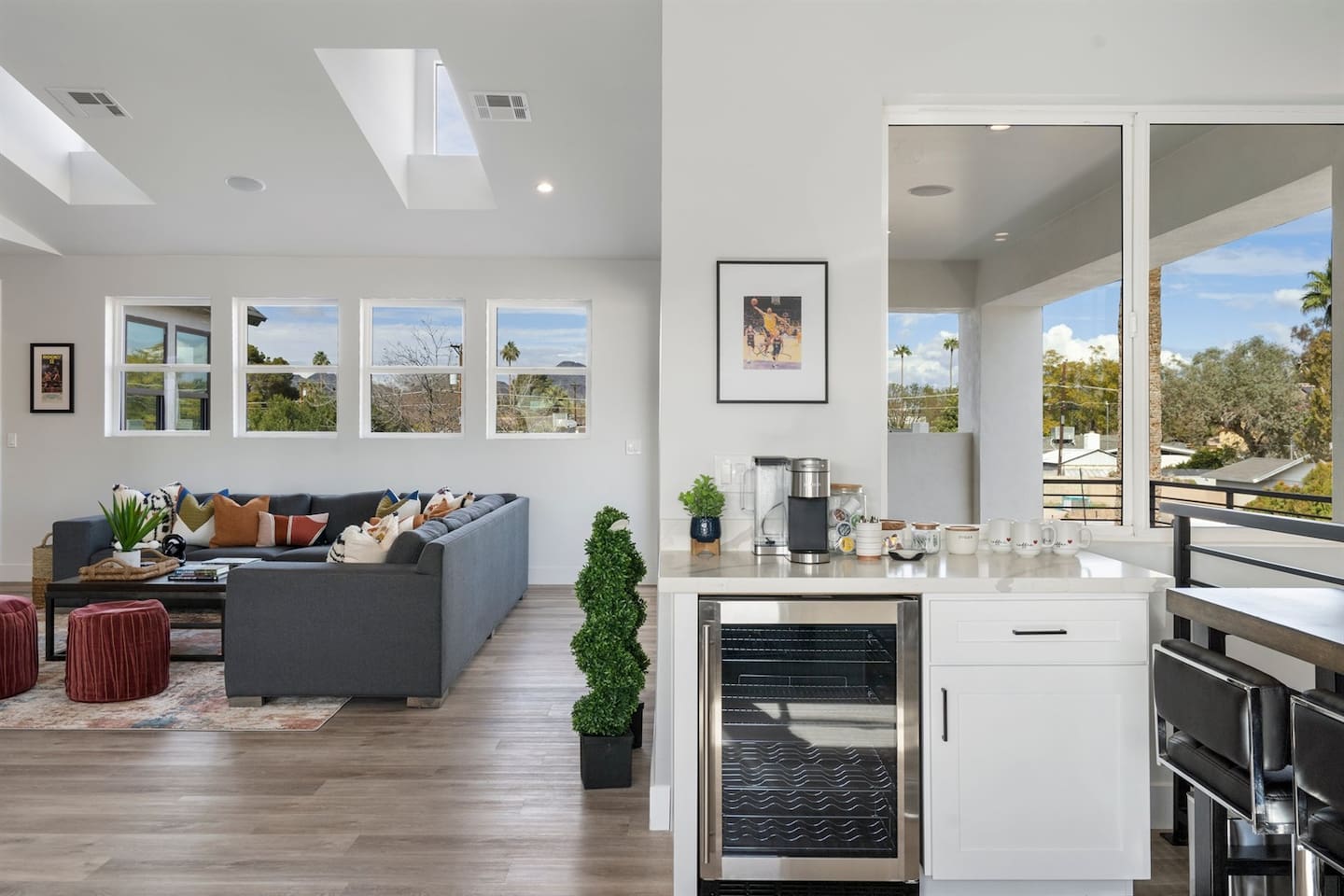 The kitchenette offers a perfect blend of comfort and entertainment, featuring seating, dedicated coffee machines, a wine cooler, and an exciting blitz arcade game for your enjoyment.