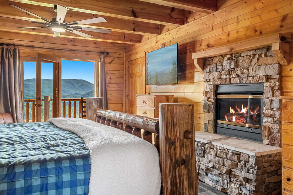 Curl up by the warm glow of the in-room fireplace in this inviting king suite, where plush comfort, a futon for extra space, and a spa-inspired ensuite create the ideal retreat on chilly mountain nights.