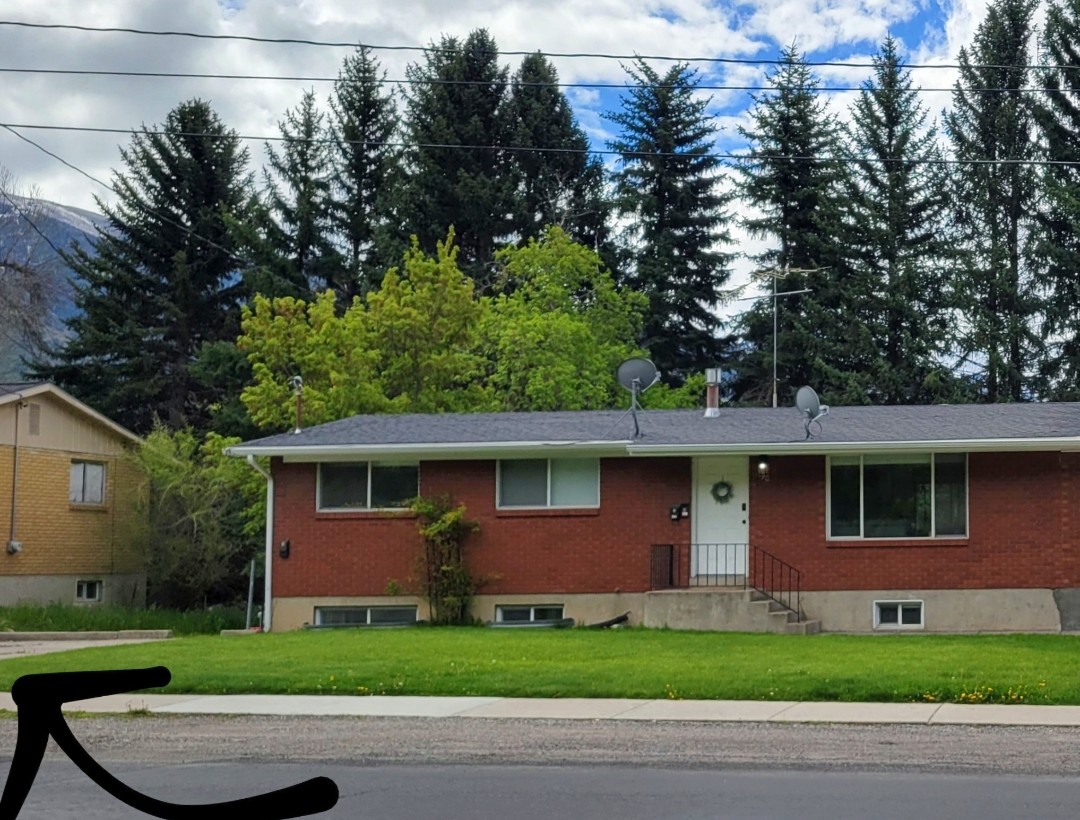 Front of home, arrow pointing to your own parking. Two small cars can fit, can park a bit on the grass if needed.