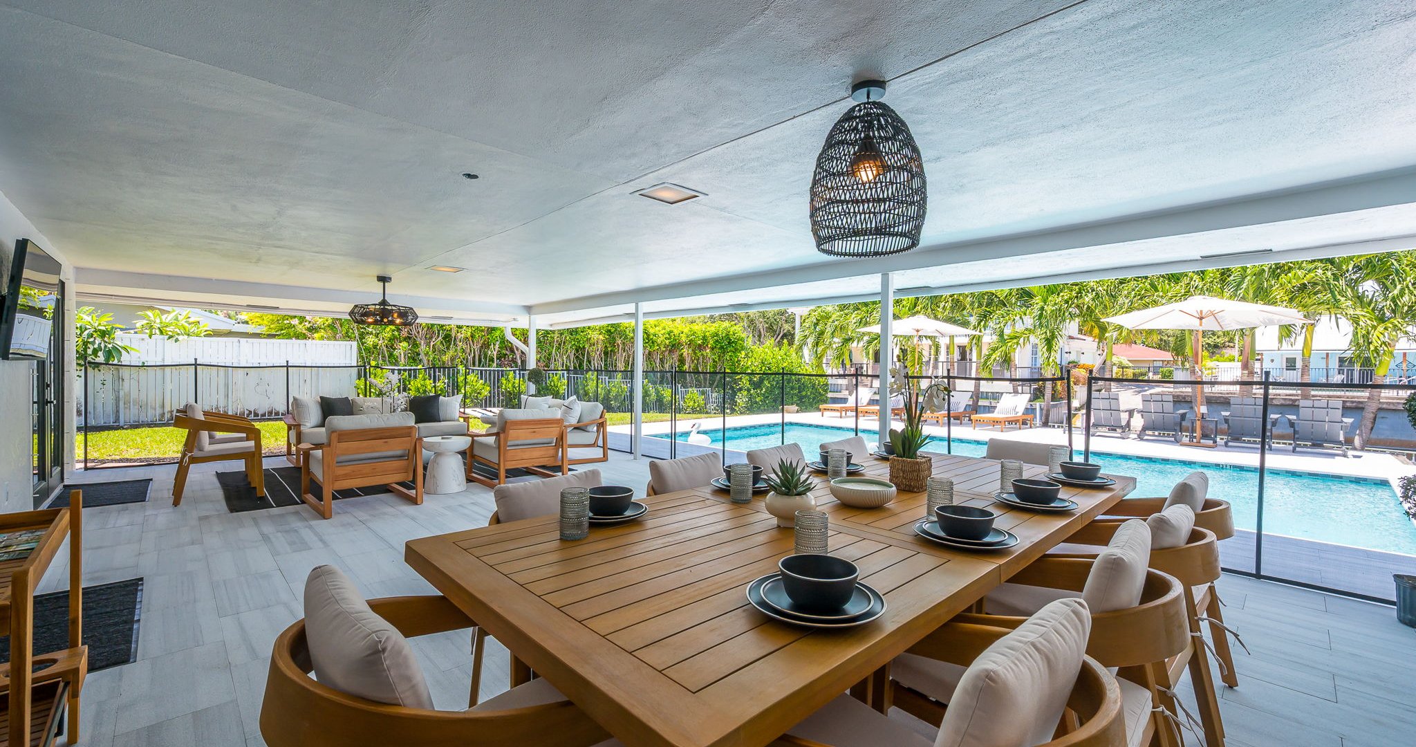 Designed for luxury and comfort, this outdoor space invites you to dine, relax, and unwind in true resort fashion. Enjoy poolside loungers, shaded patio seating, and an ambiance that blends modern elegance with the ease of Florida living