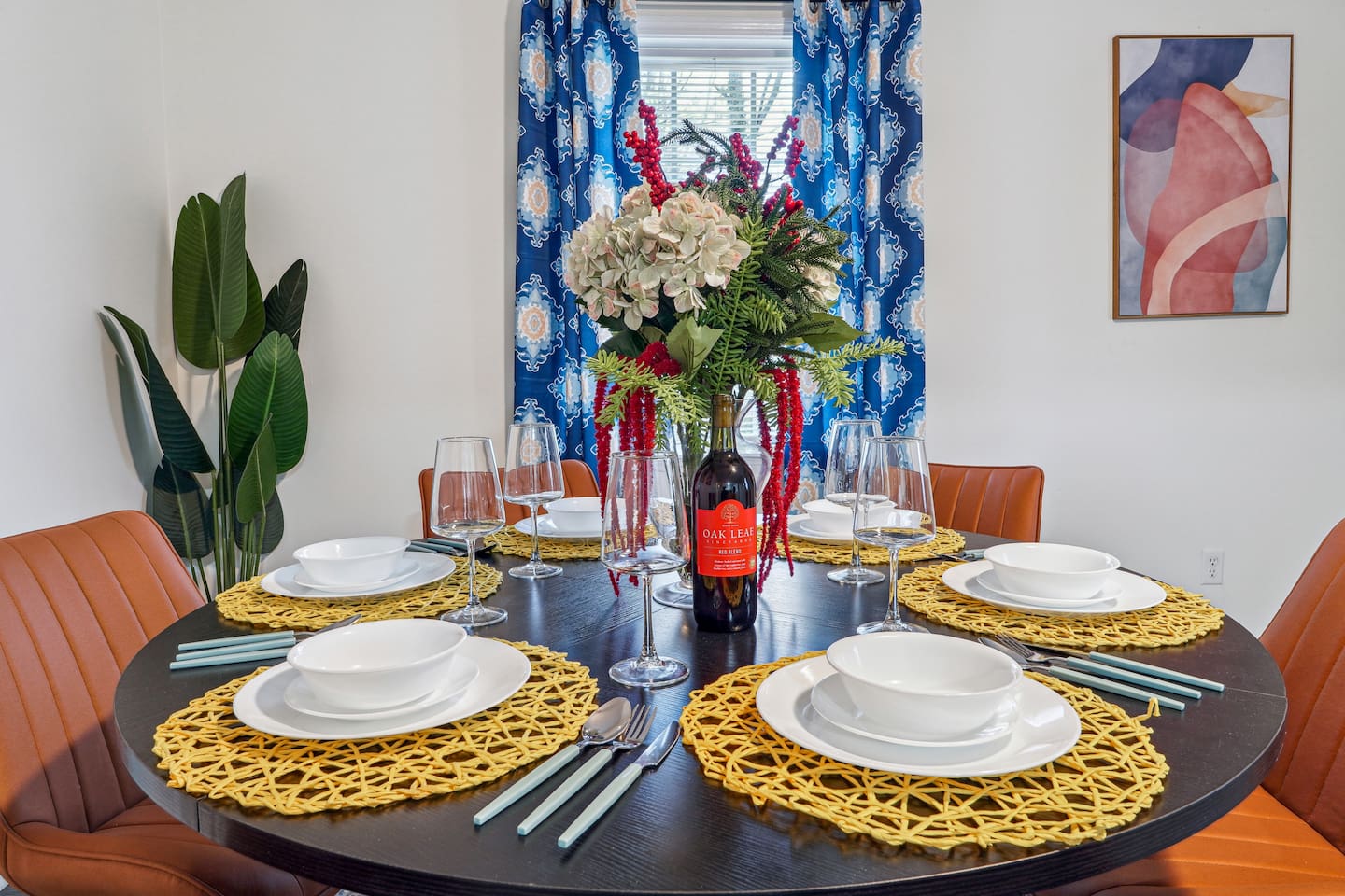 A dining area featuring a dining table set and a bar counter with four bar chairs — perfect for enjoying meals or casual drinks.
