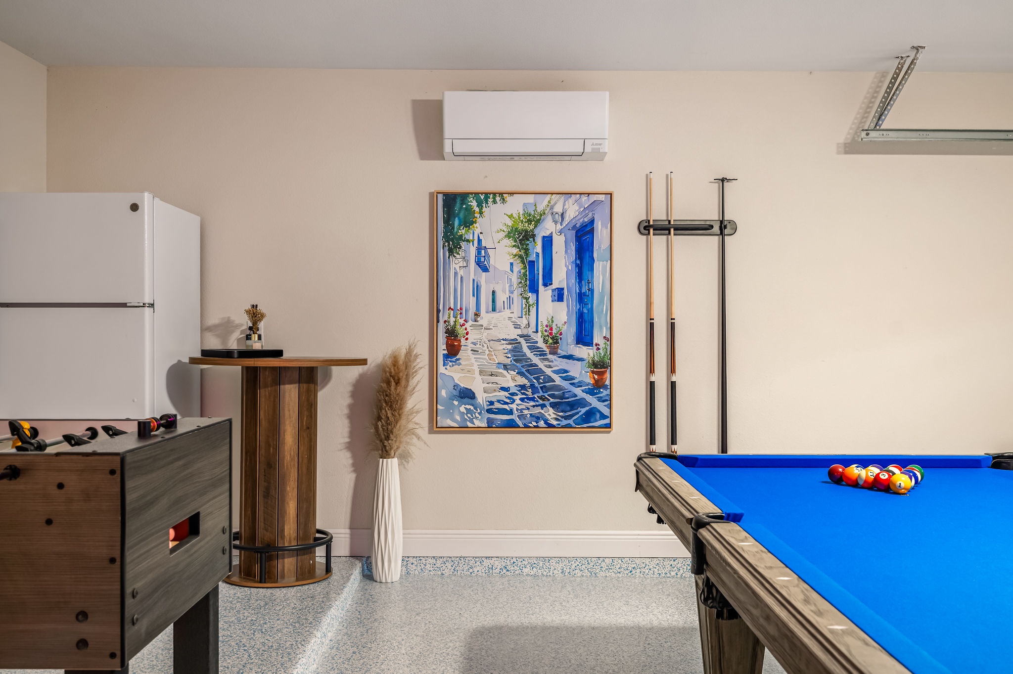 Another view of the fun-filled game room featuring pool table and lounge space.