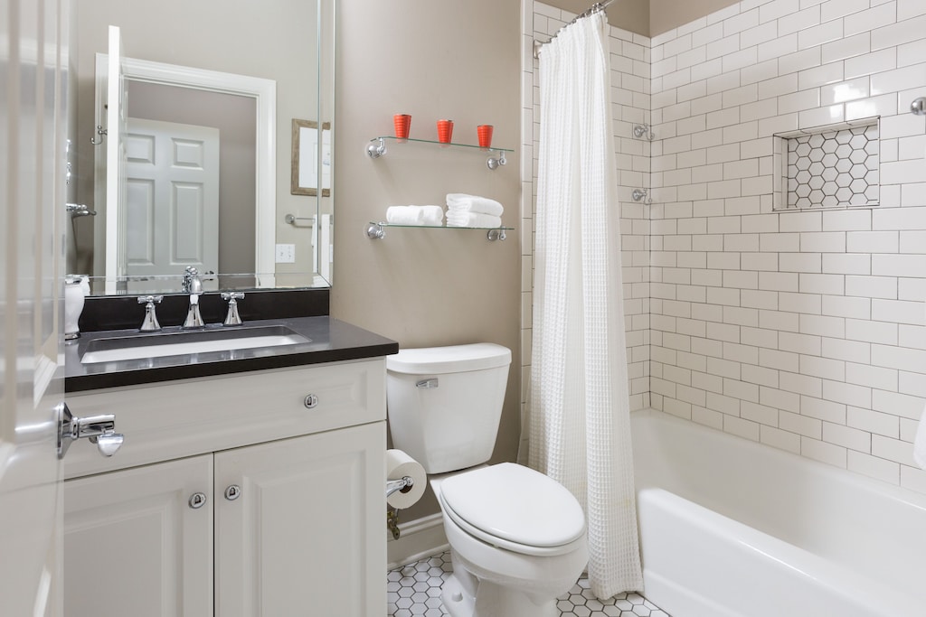 2nd Master bedroom bathroom features subway tile and quartz counter top