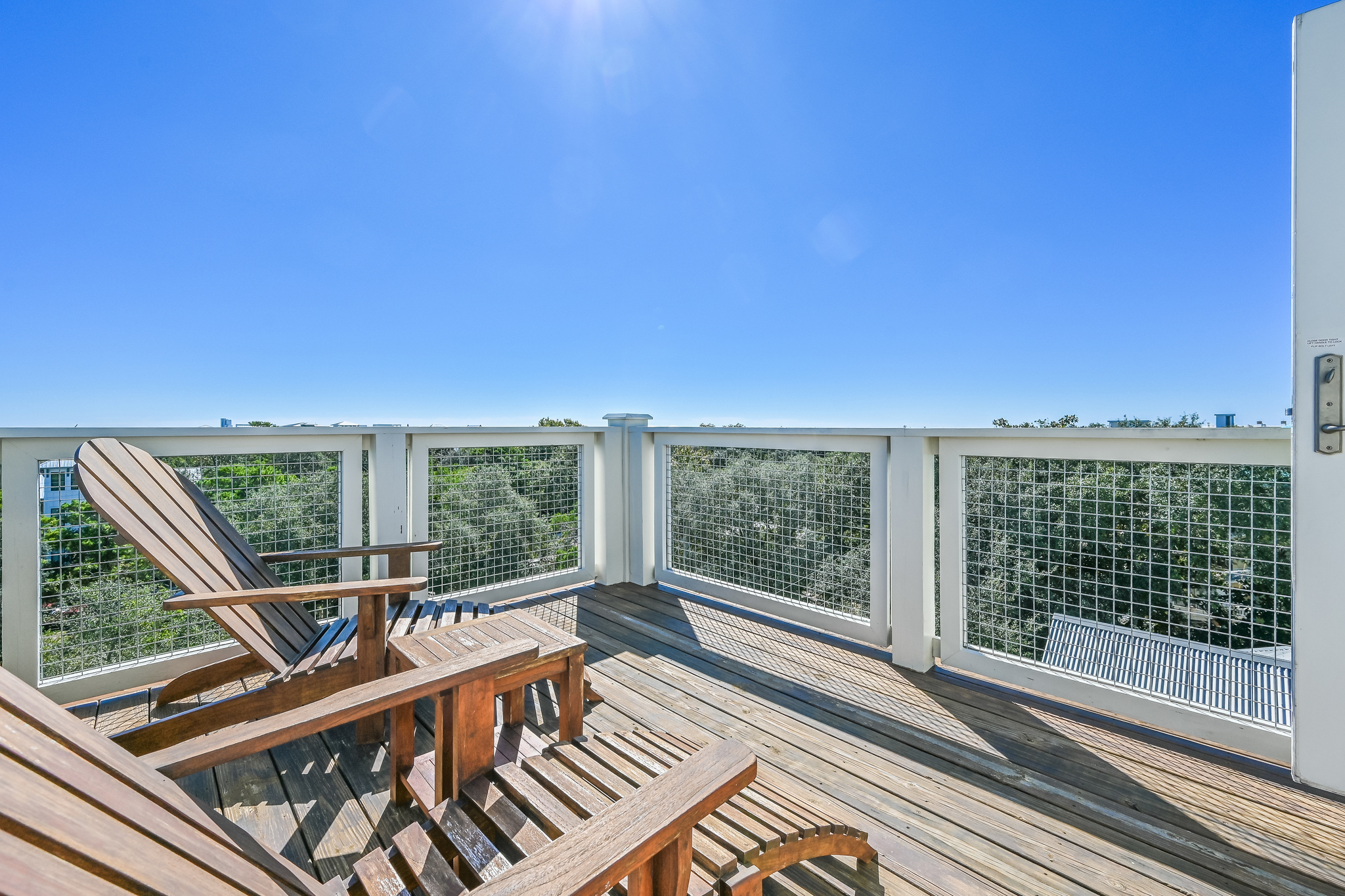 The east side rooftop deck offers two chairs for relaxing in the sun.