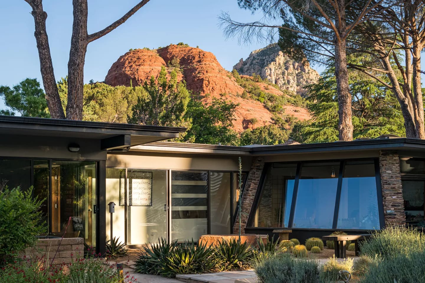 Clean mid-century lines framed by lush desert landscaping and Sedona’s iconic red rock backdrop.