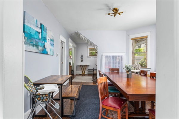 Share delicious meals together with plenty of seating for your whole group at the elegant wooden dining table and additional side table, complete with a high chair for little guests