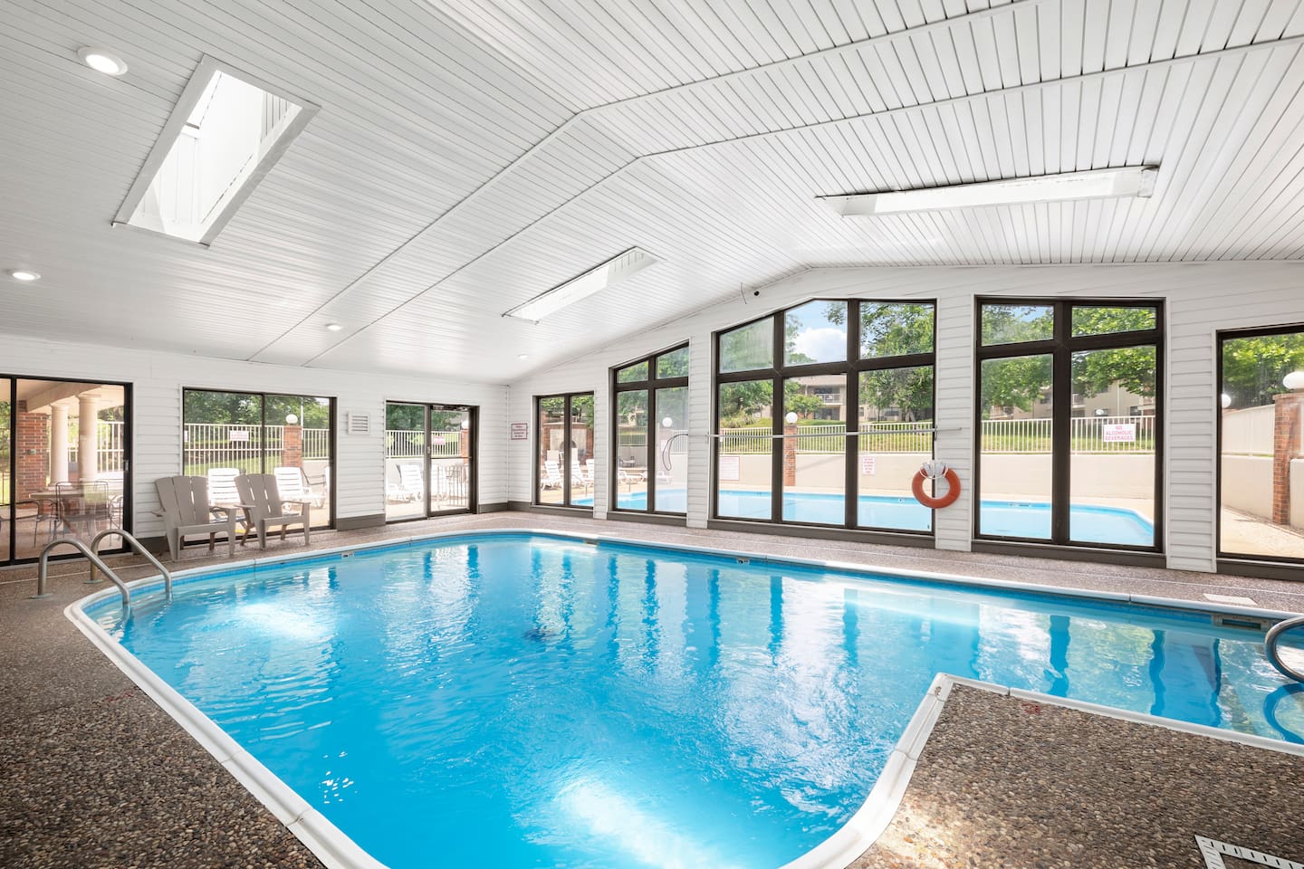 Indoor Pool Oasis: Swim and relax in this sunlit indoor pool with stunning views!
