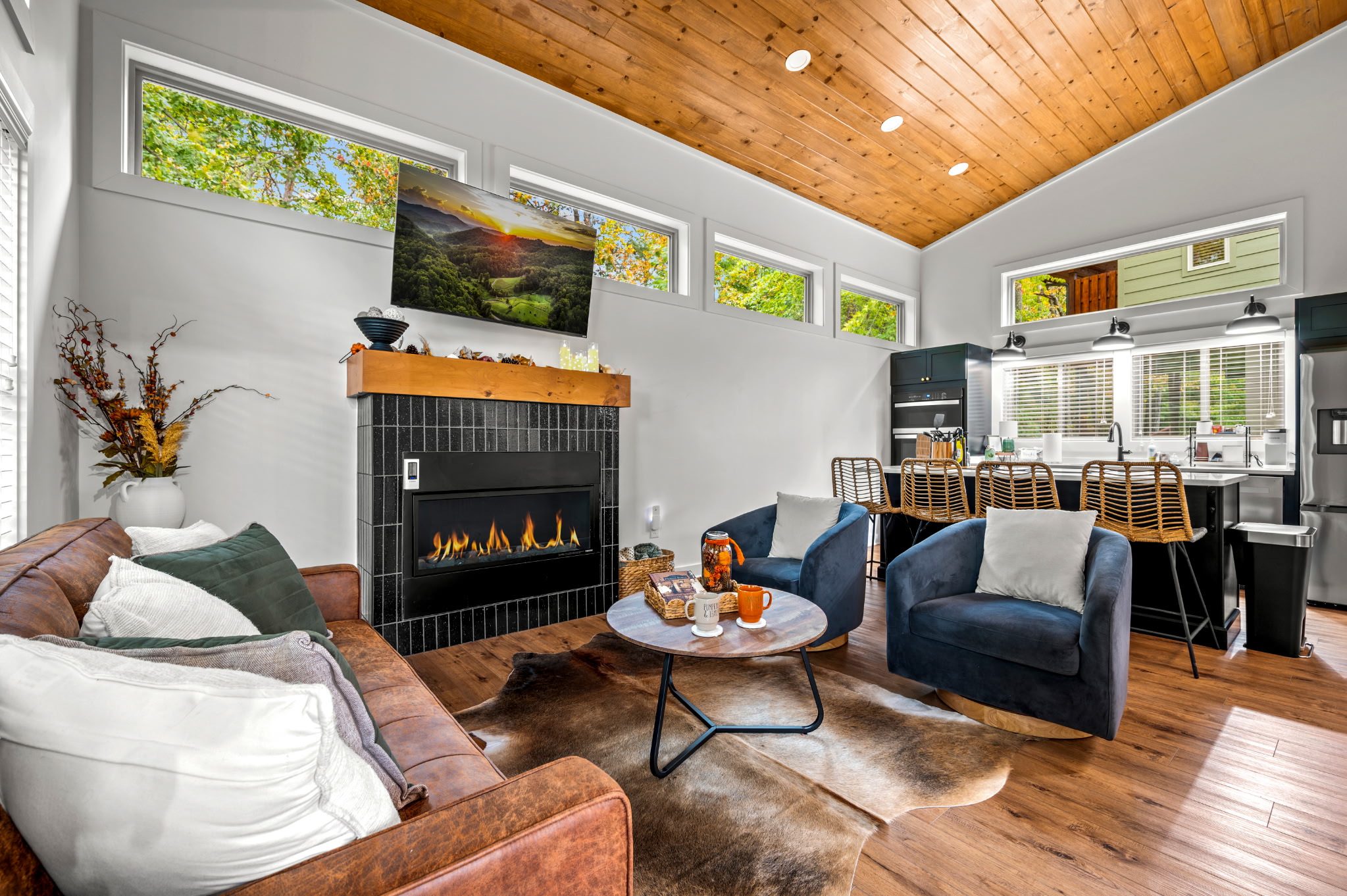 Open layout with spiral staircase and vaulted ceilings - cabin-in-the-trees vibe without feeling rustic or dated, built 2025 with all modern amenities. 
