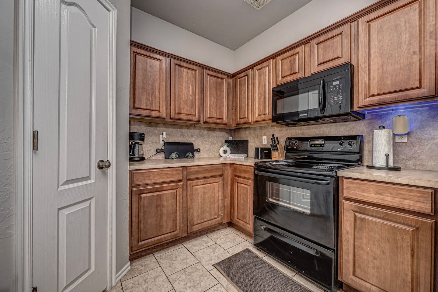 Bright kitchen featuring a cozy table set for four guests.