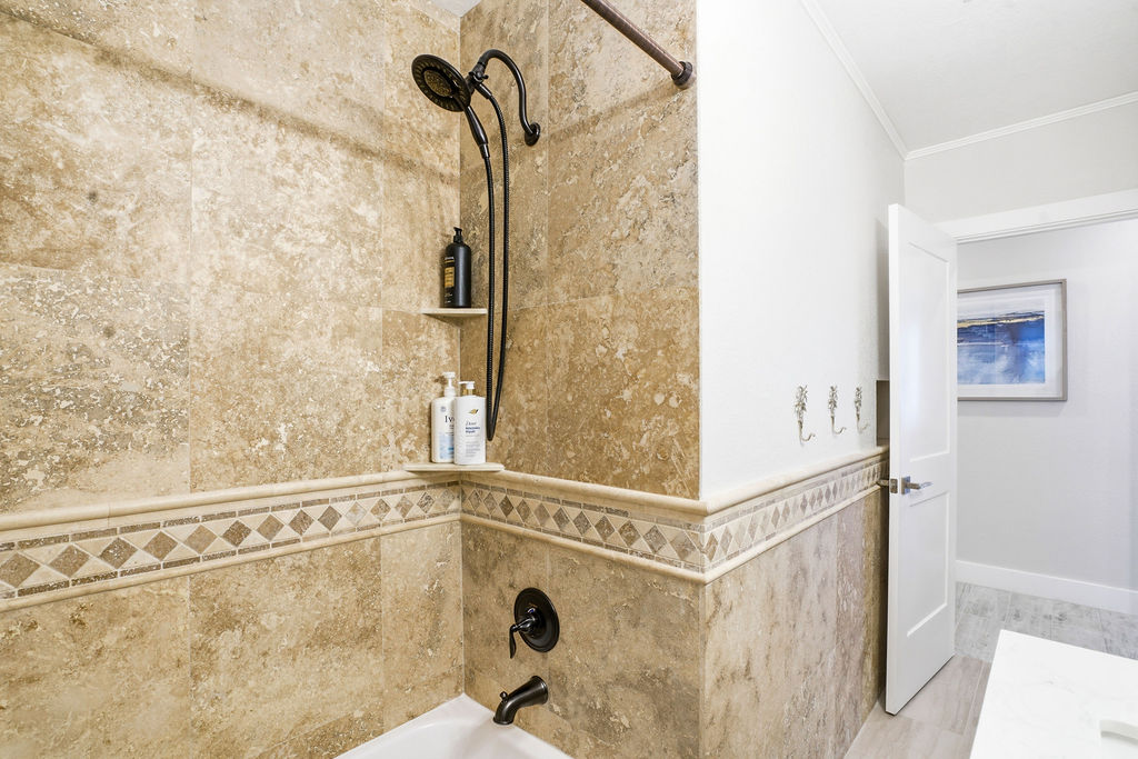 Bathroom 1 features a bath tub combo.