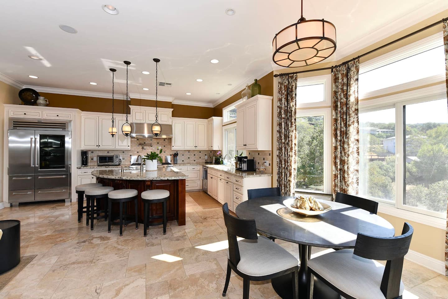 Fully stocked kitchen with 4 person dining table and 4 person kitchen island seating.