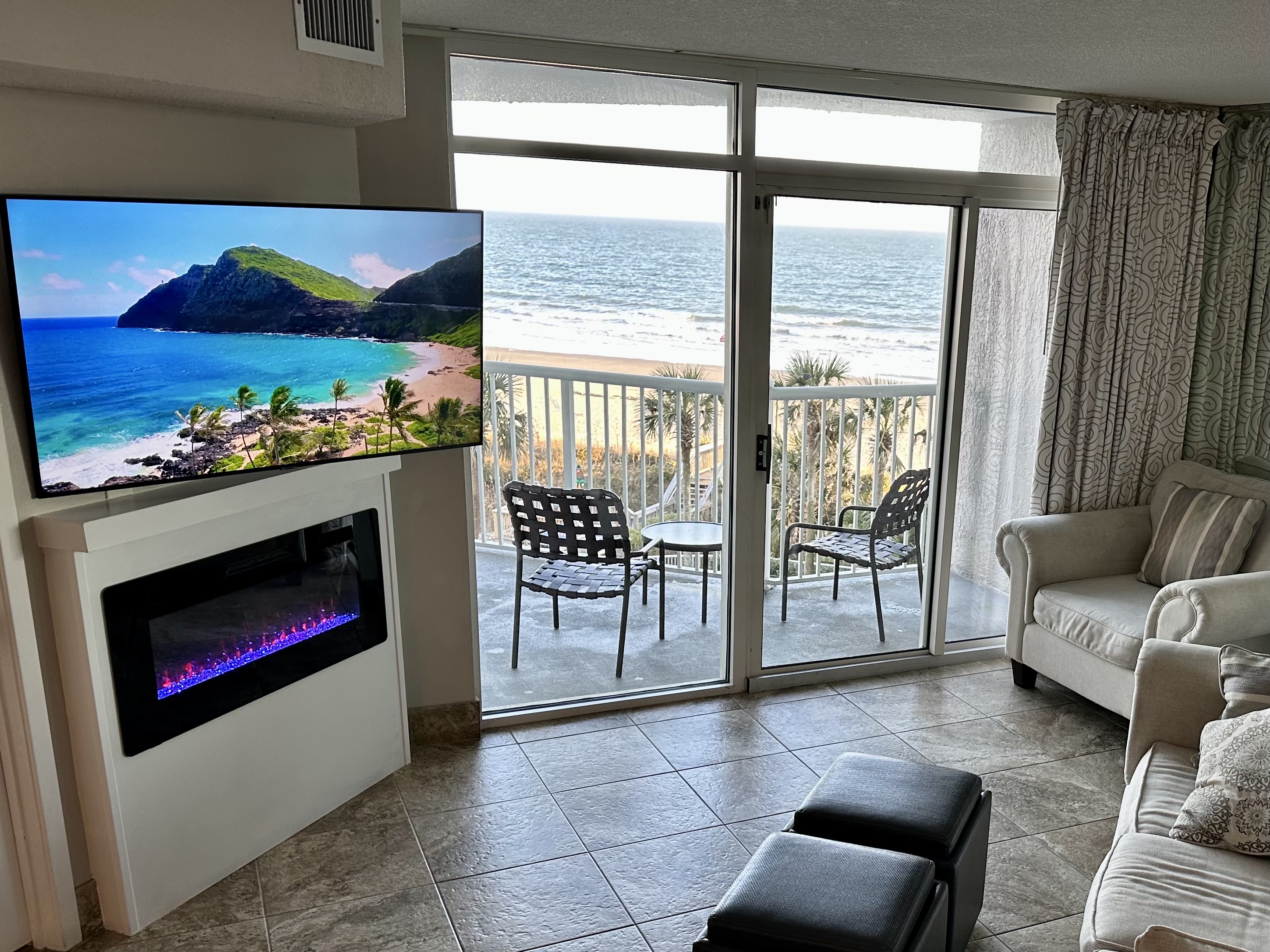 The living room features an electric fireplace & Smart TV w/ full cable lineup.