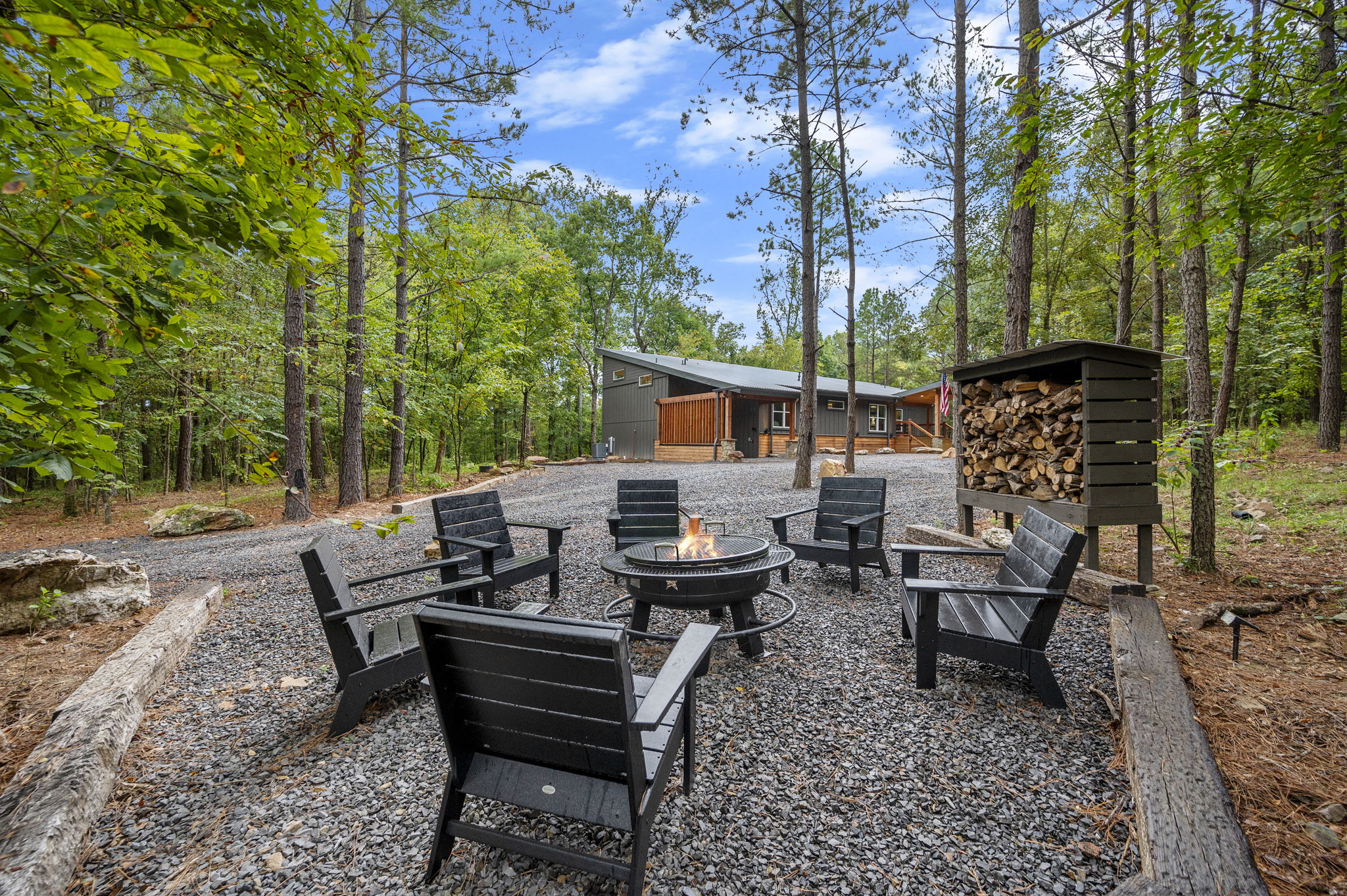 Stay Rooted: wooded cabin setting with a private fire pit.