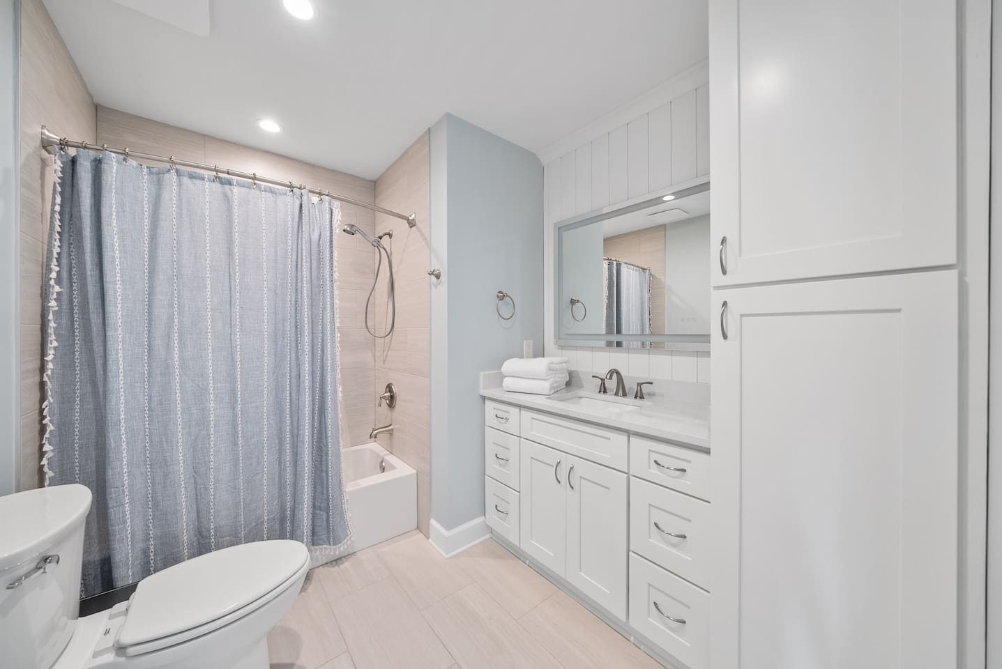Full bathroom with a shower/tub combo in Unit A. 