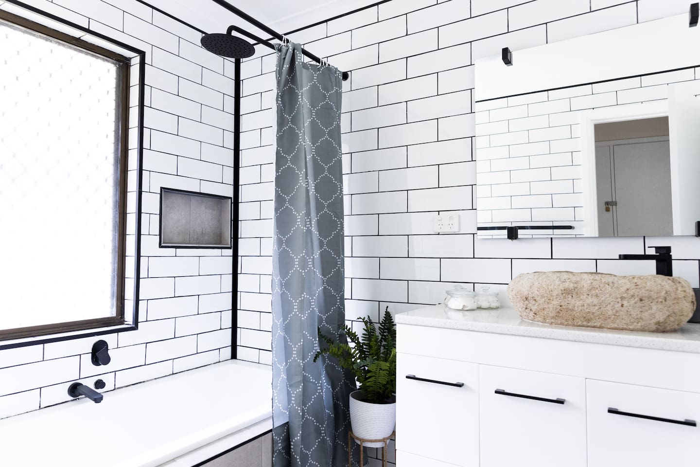 bathroom with tub and shower