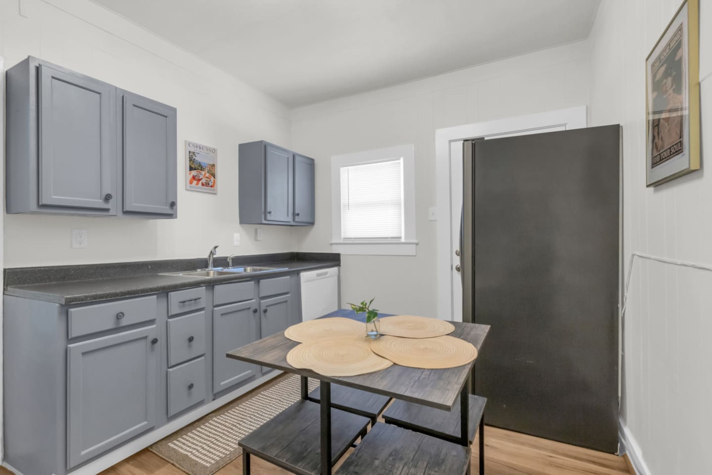 Eat-in kitchen with dining table and bright natural light.