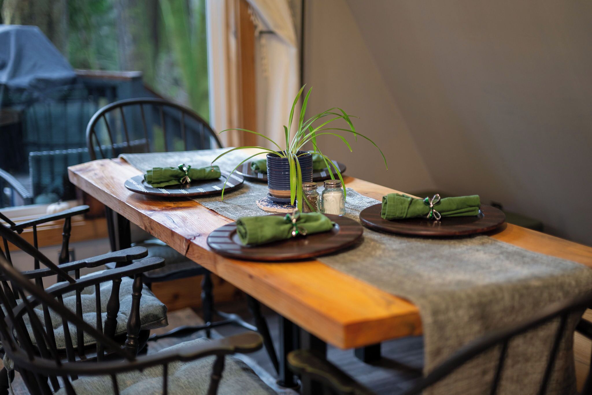 Enjoy dinner at our custom cedar table built with wood from the property
