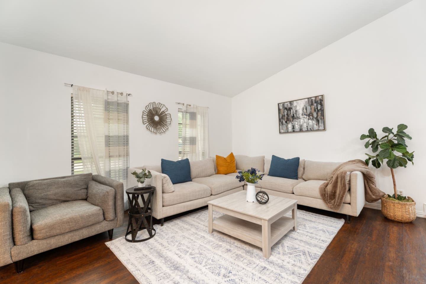Bright and airy living room with sectional and natural light.