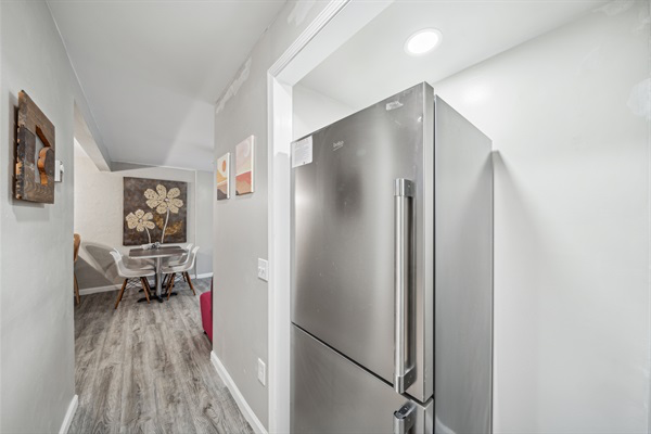 The hallway to the bedrooms has a standard refrigerator. The freezer is on the bottom, 100% below 54" and the fresh food storage drawers and first 2 shelves are below 54".