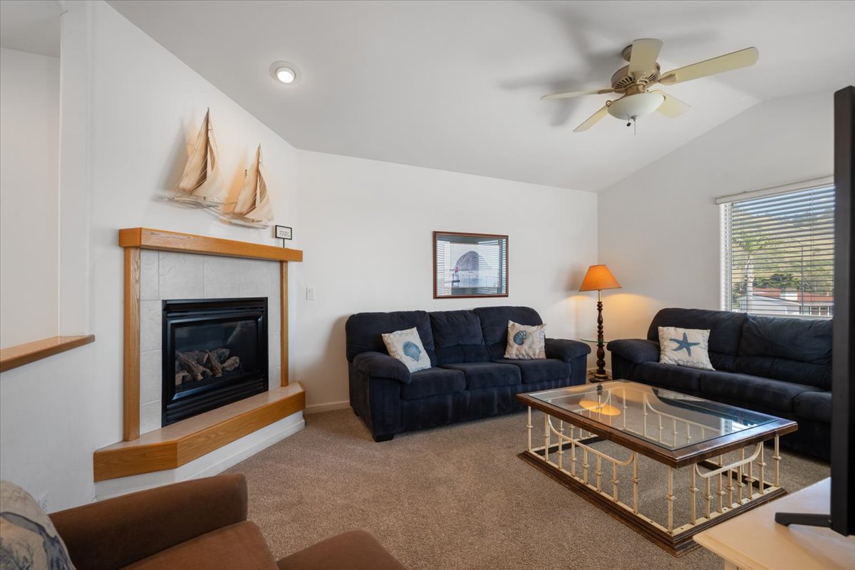 Upstairs living area with fireplace and tv